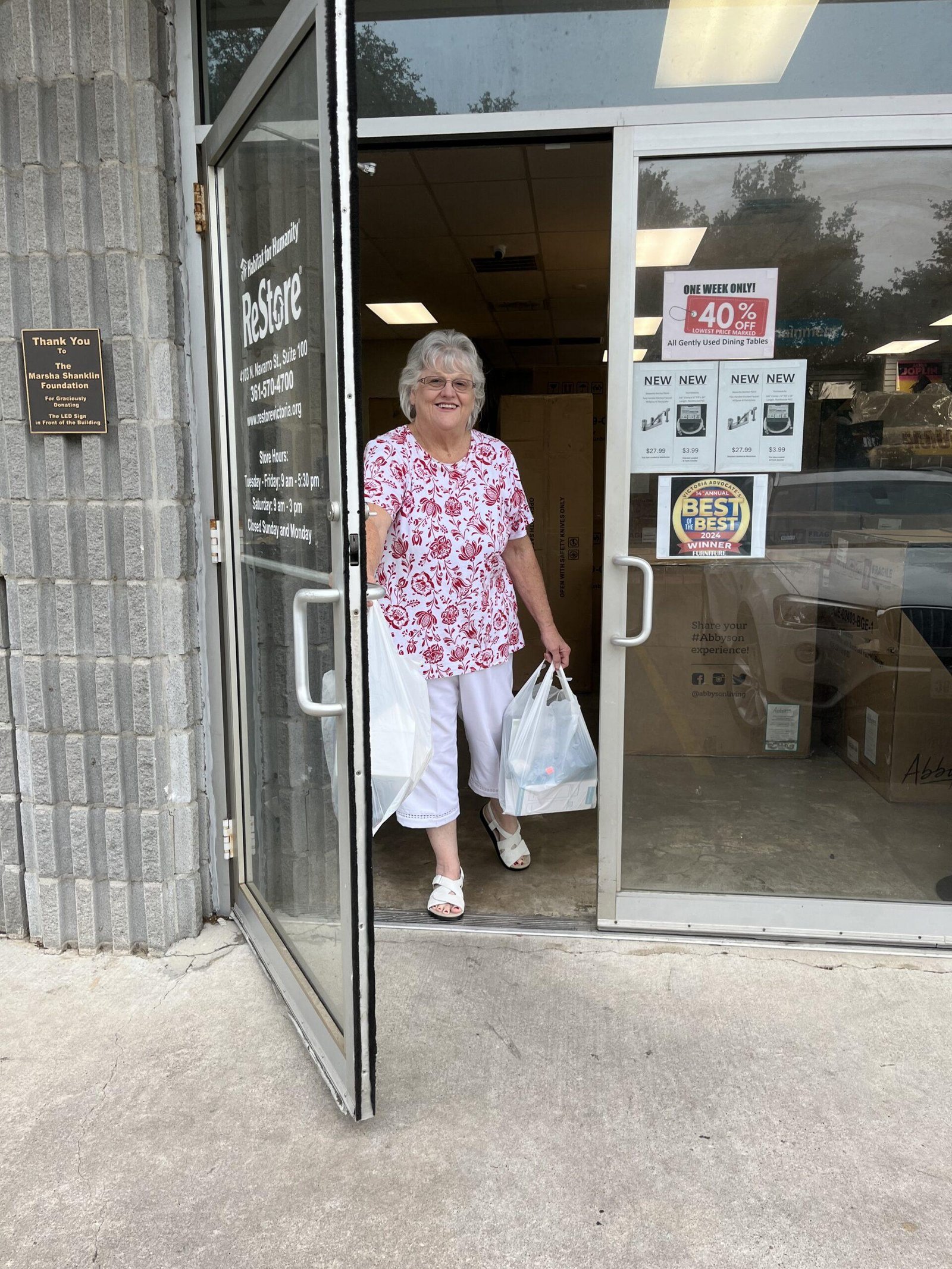 The gorgeous Vickey holding bags from the restore