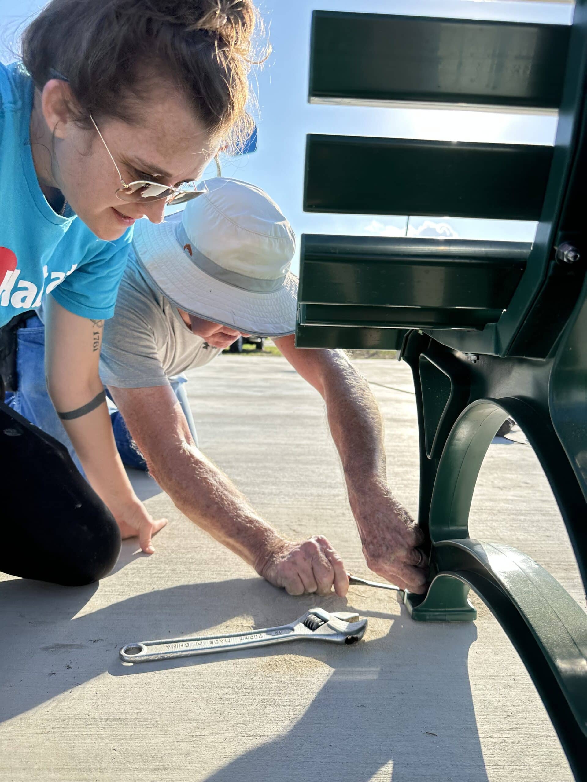 Golden Crescent Habitat for Humanity volunteer building a bench outside